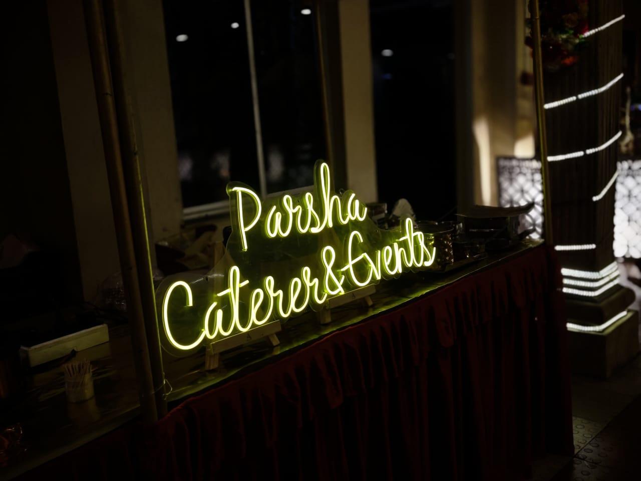 Parsha Caterer neon sign at an event