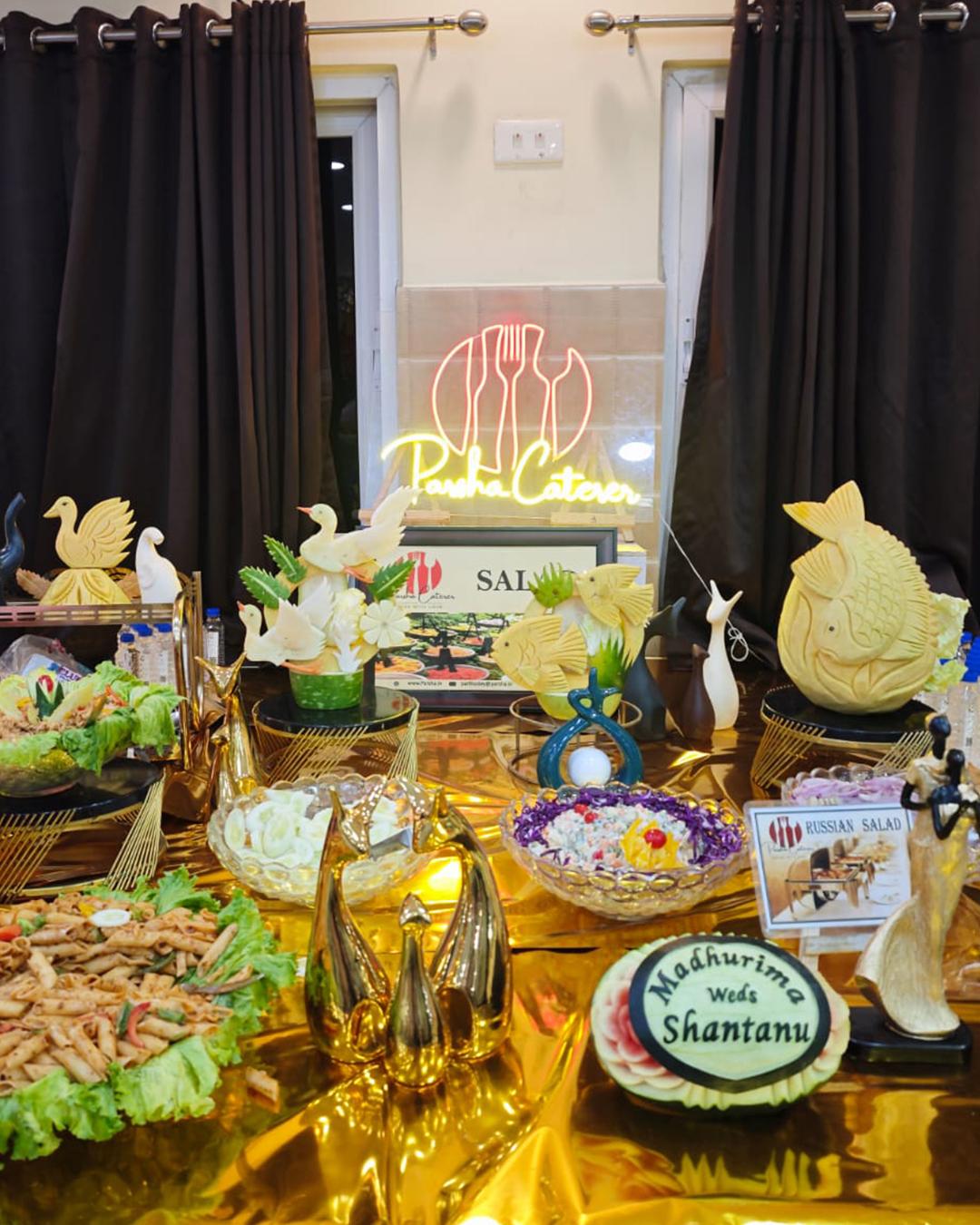 Customized catering counter with floral decor and guests